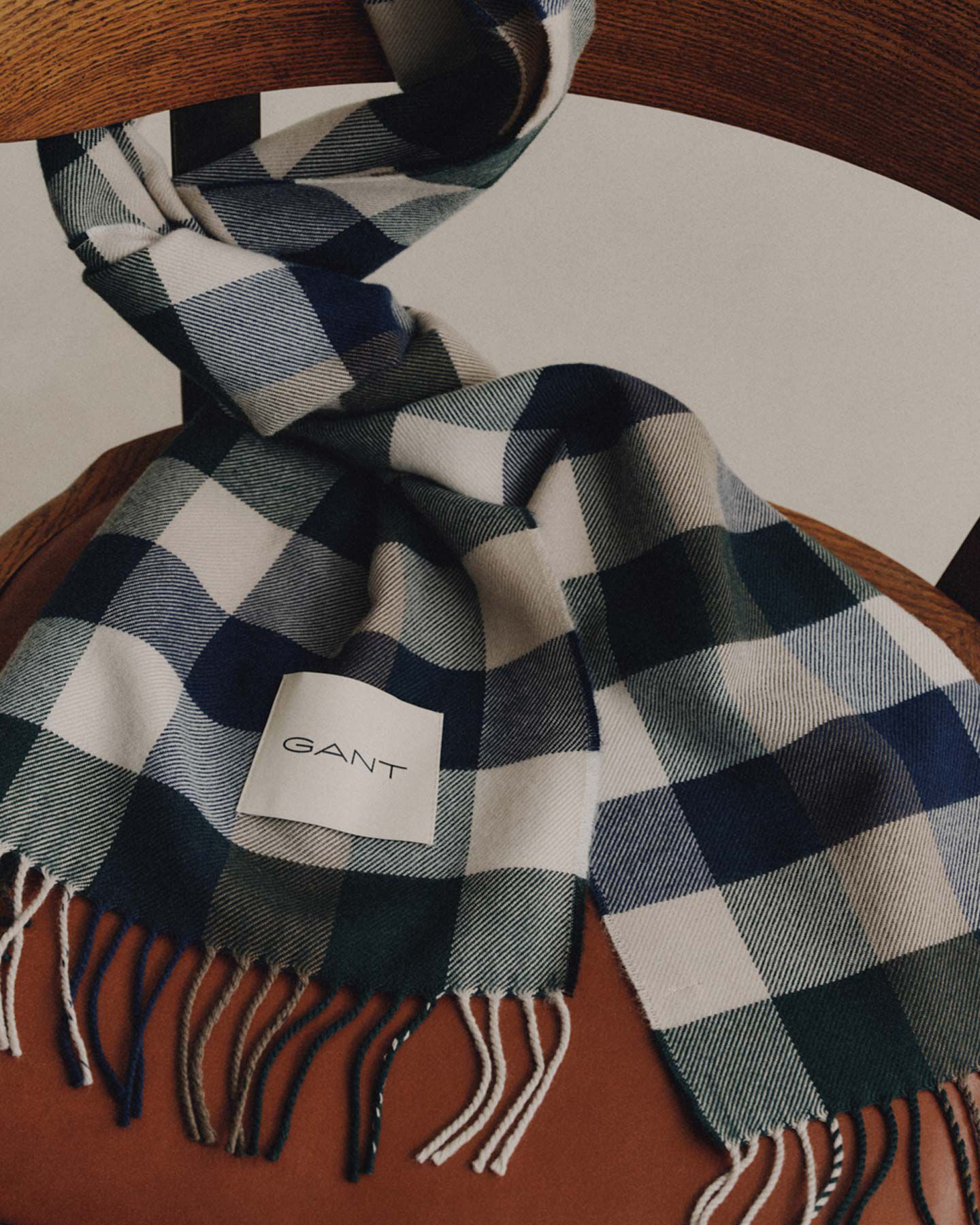 Grey tonal checked scarf on chair