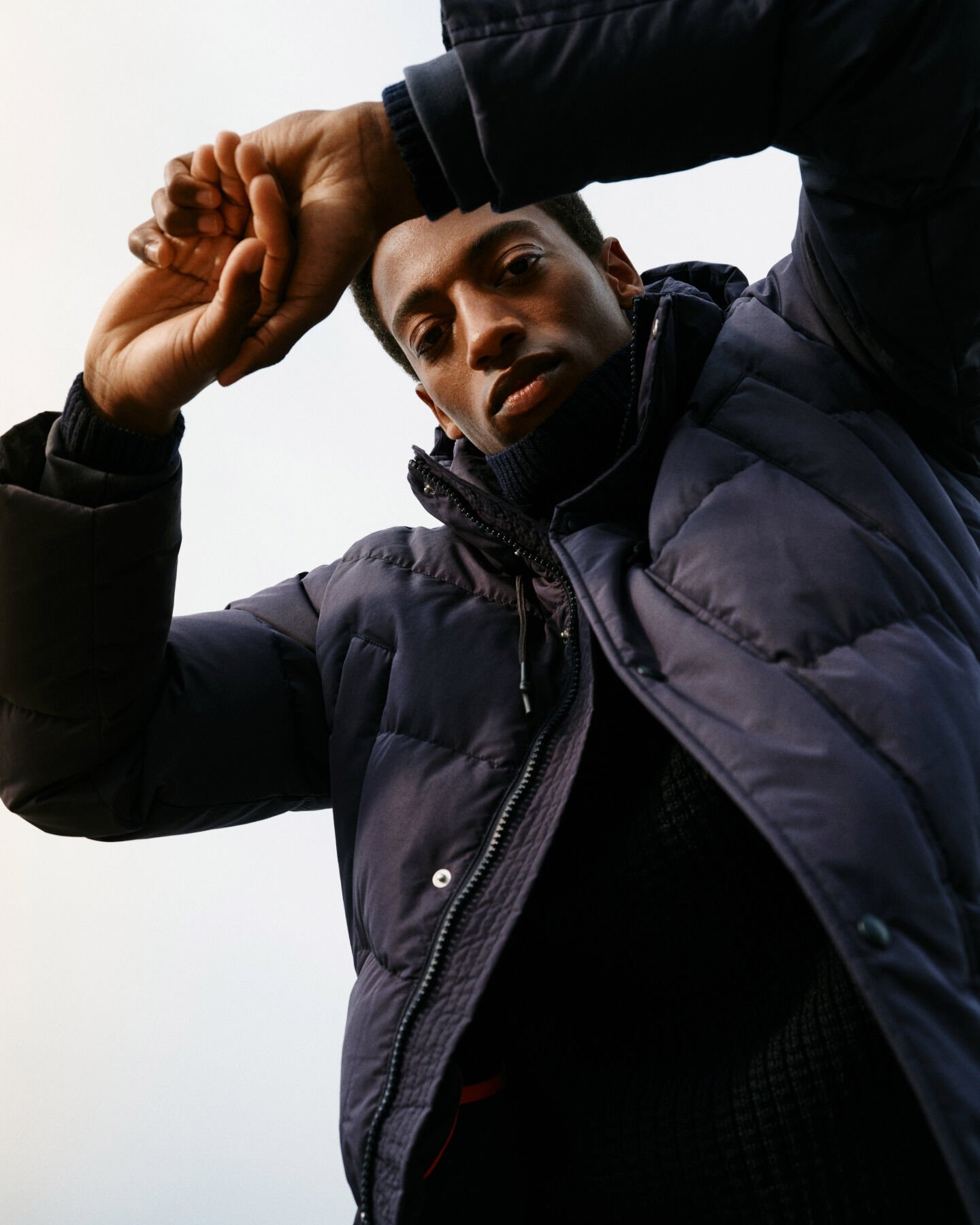 Man wearing Alta Down Jacket in evening blue