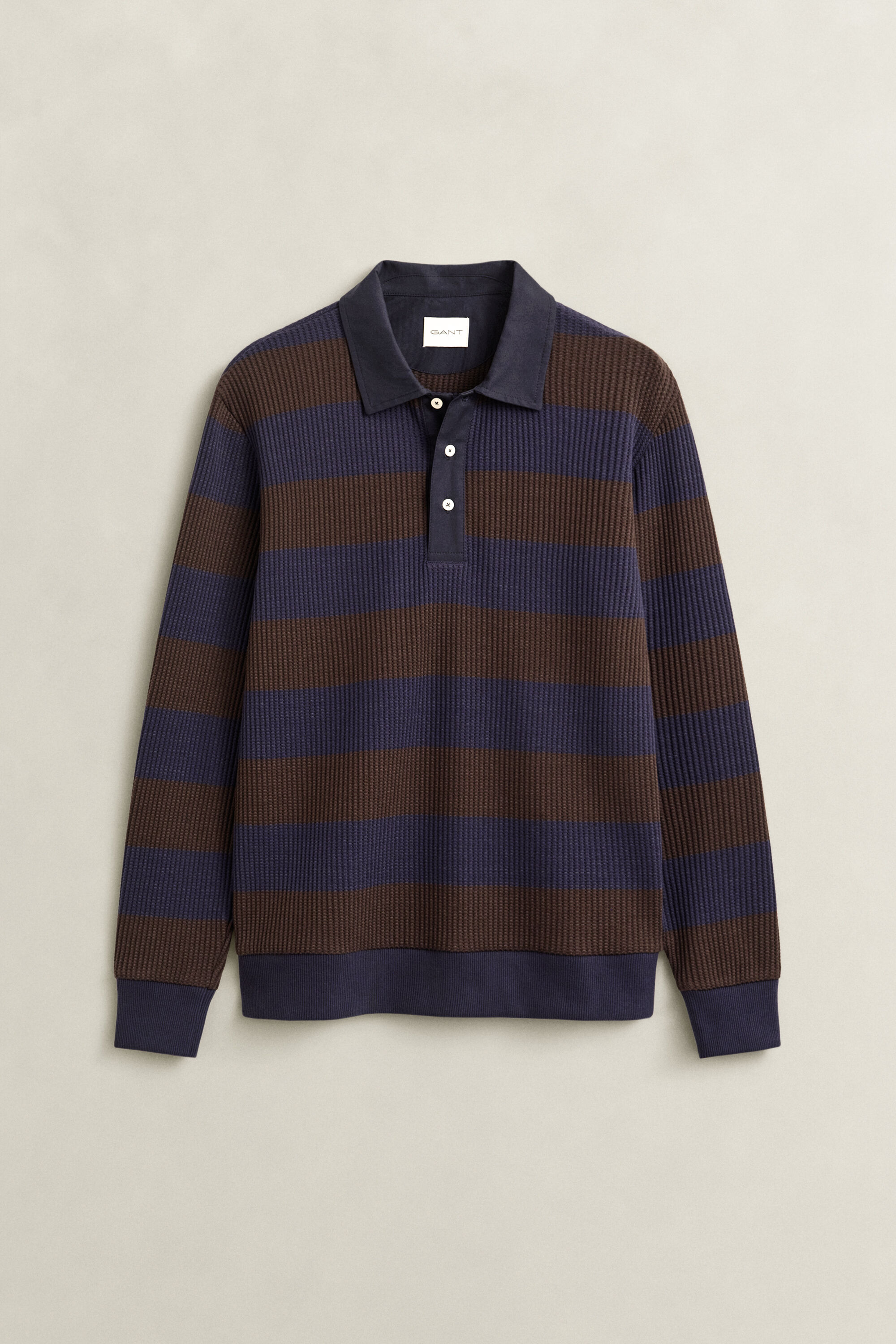 Polo con textura de nido de abeja a rayas