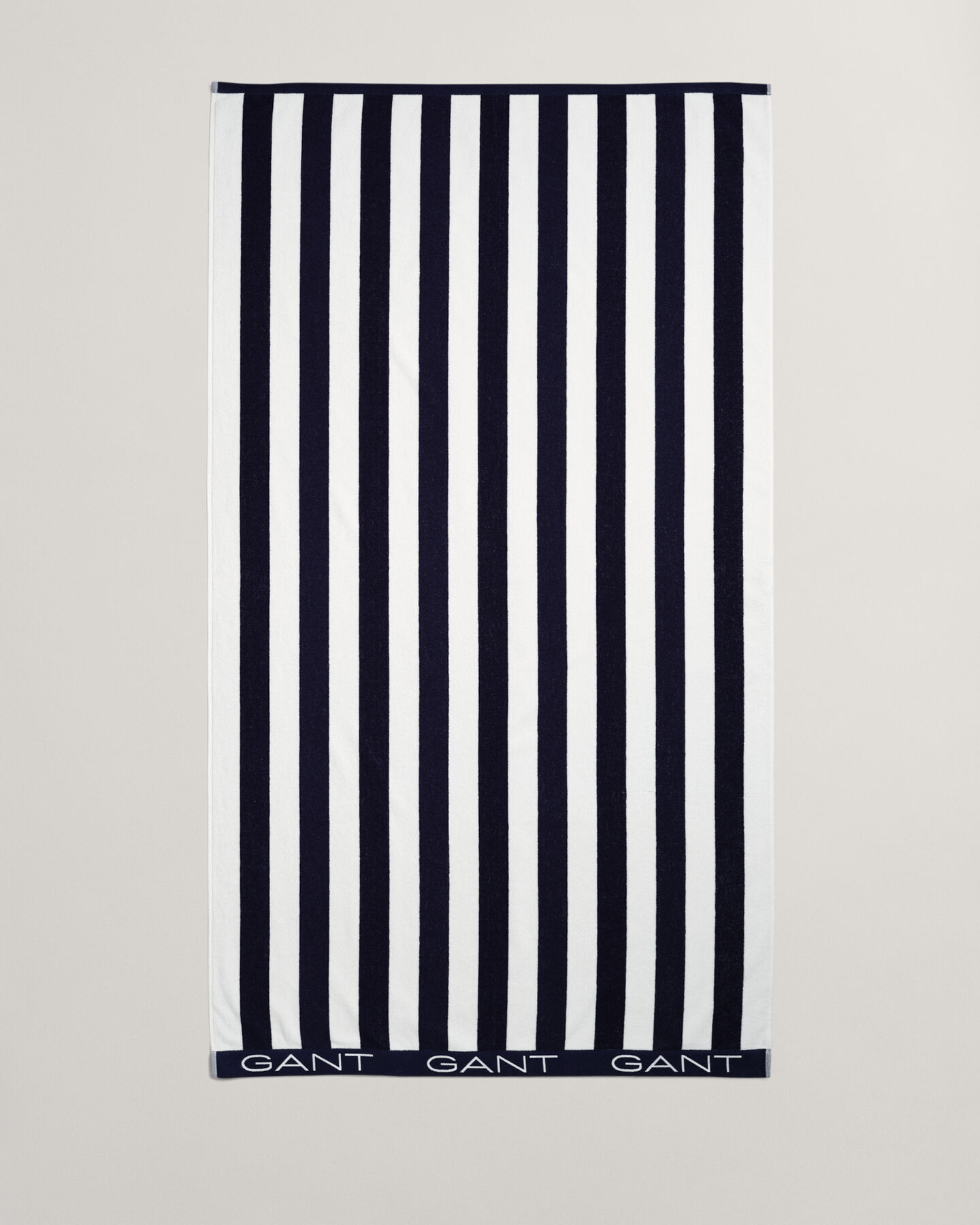 Toalla de playa de rayas en bloque