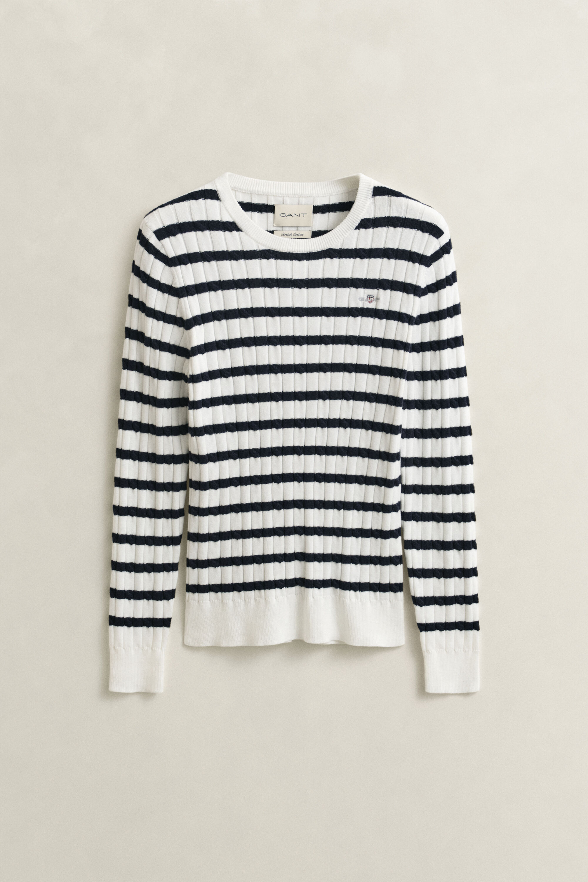 Jersey de cuello redondo y punto de ochos a rayas