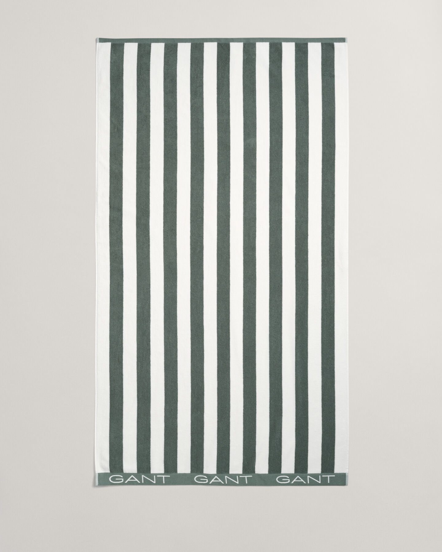 Toalla de playa de rayas en bloque