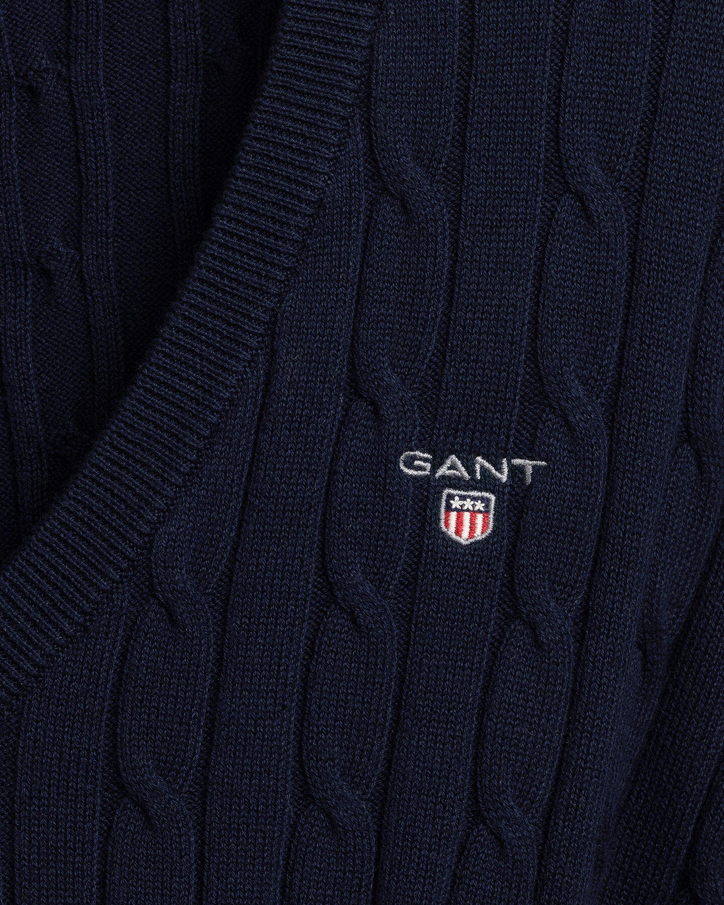 Jersey de punto de ochos con cuello de pico en algodón elástico