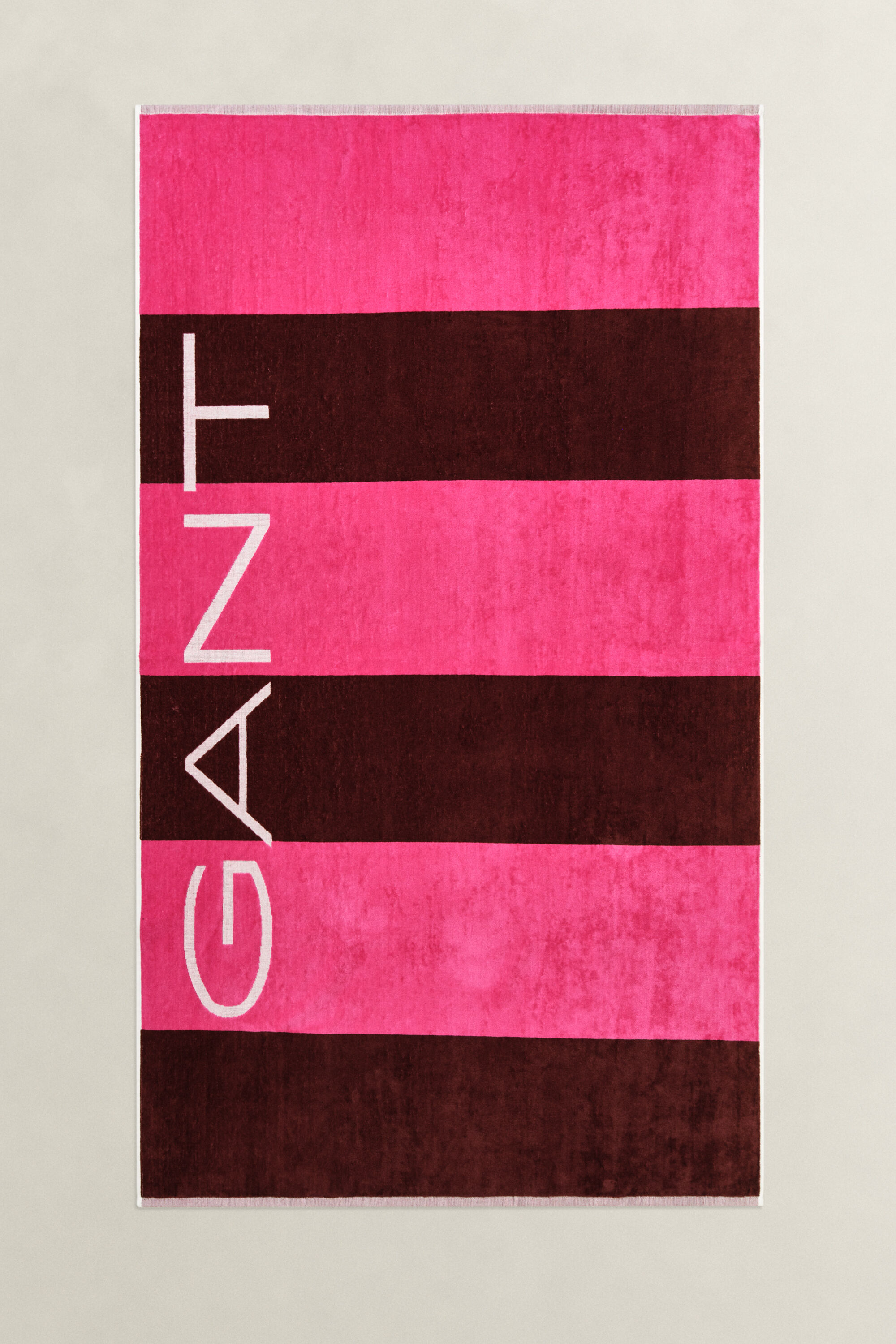 Toalla de playa de rayas en bloque