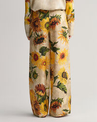 Pantalones de seda y pernera ancha con estampado de girasoles
