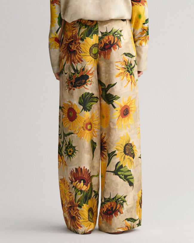 Pantalones de seda y pernera ancha con estampado de girasoles