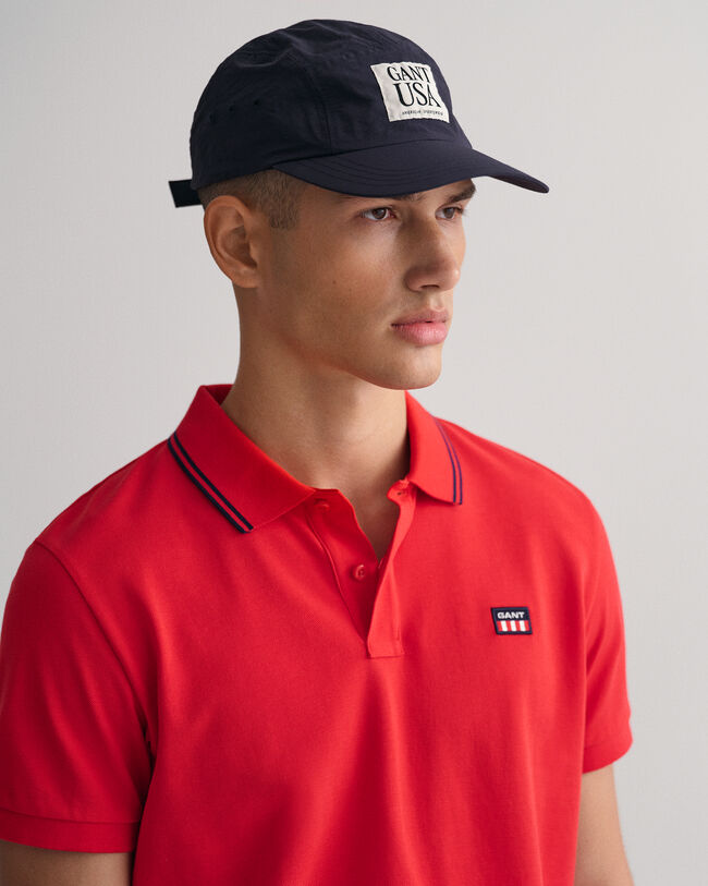 Polo de piqué con cuello a rayas en contraste