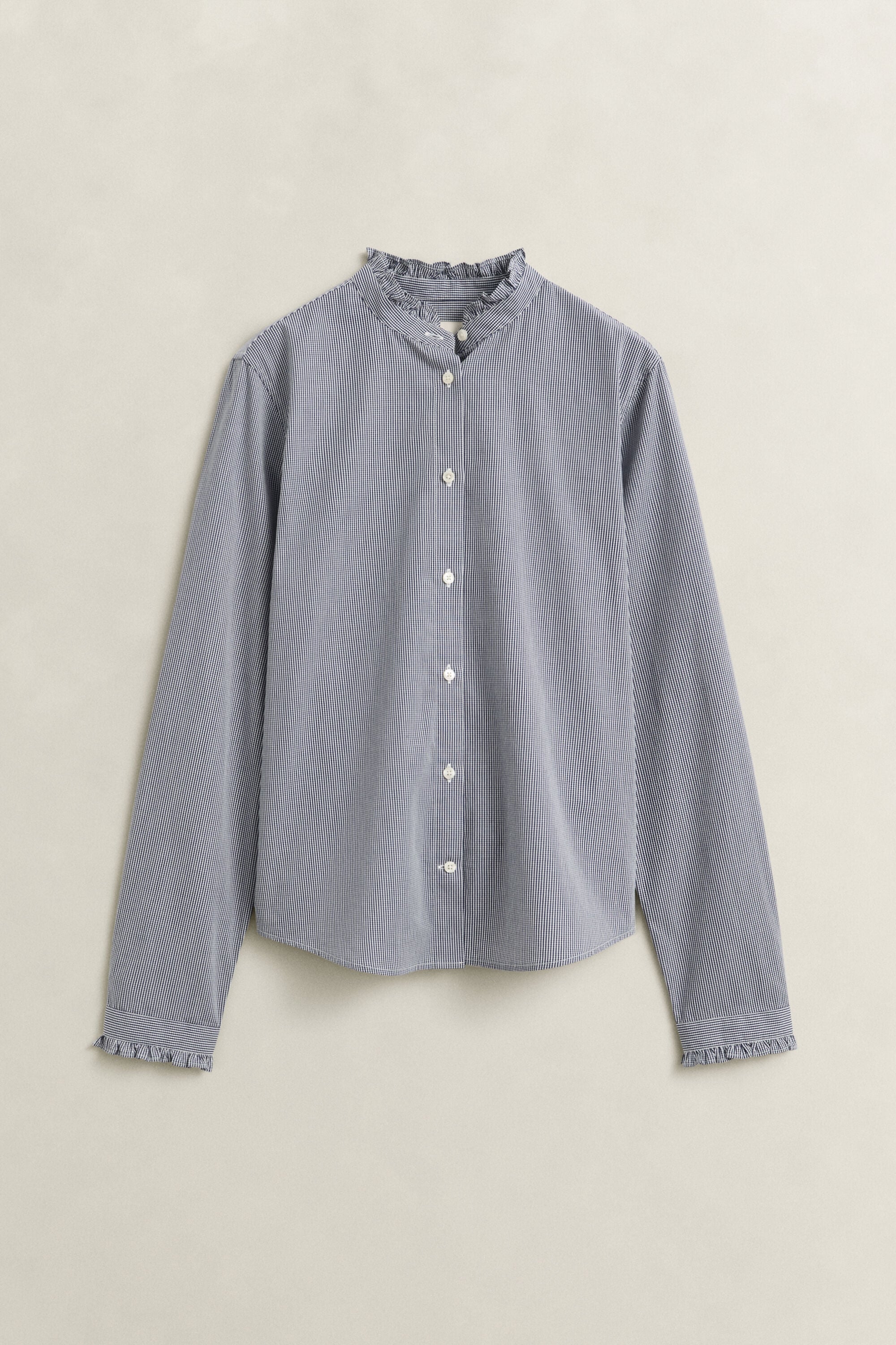 Blusa con volantes en el cuello