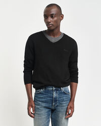 Jersey de lana merino extrafina con cuello de pico