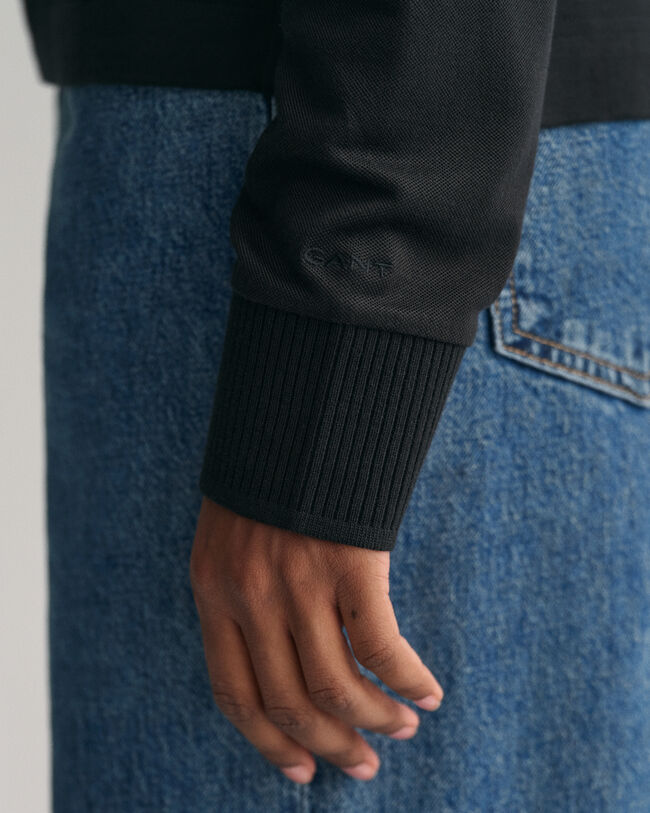 Polo de manga larga con cuello y detalle