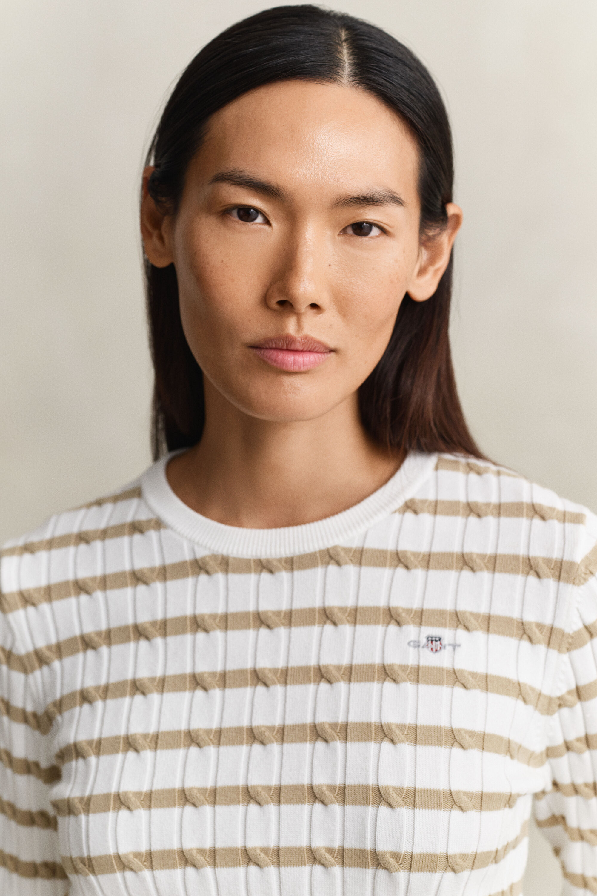 Jersey de cuello redondo y punto de ochos a rayas