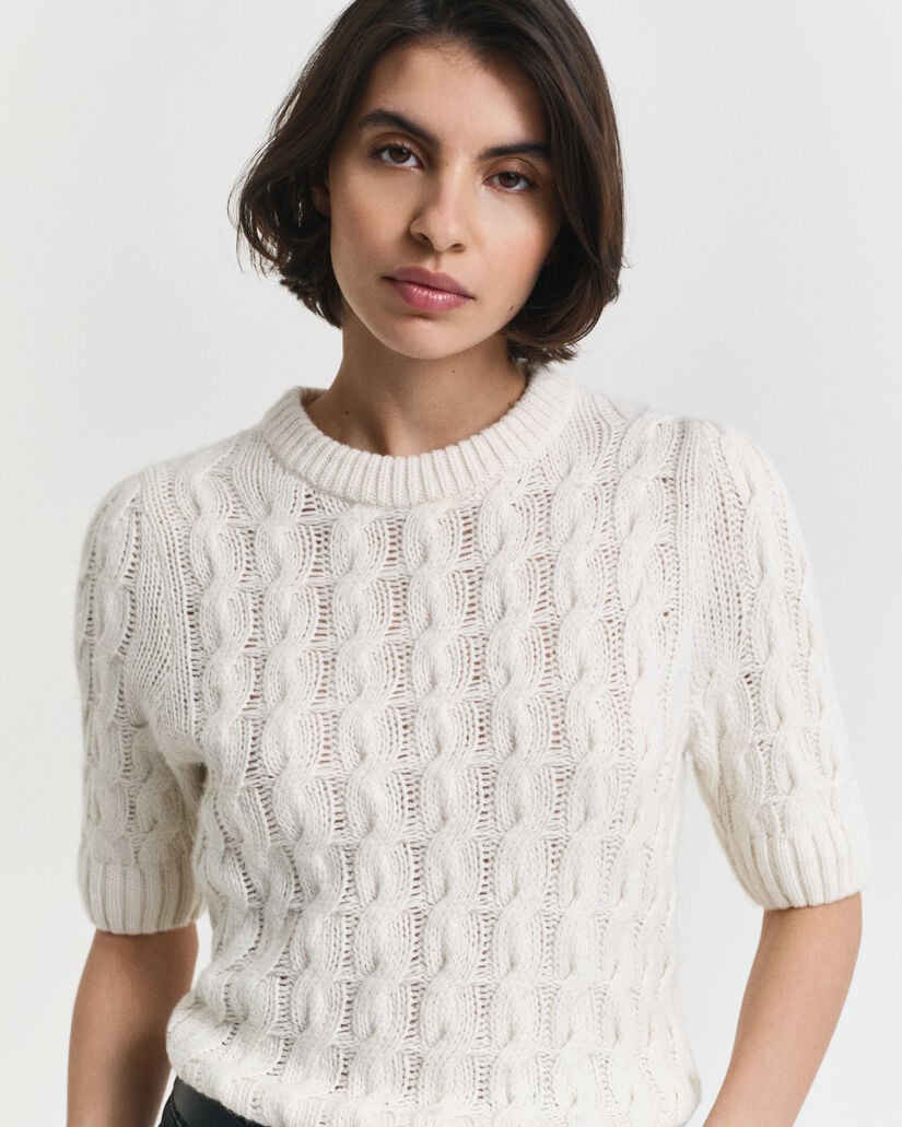 Jersey con diseño de ochos y manga corta abullonada