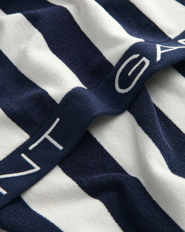 Toalla de playa de rayas en bloque