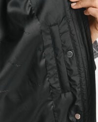 Abrigo acolchado con ribete de pana