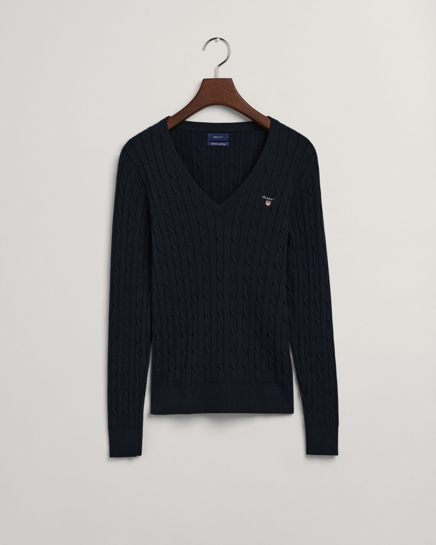 Jersey de punto de ochos con cuello de pico en algodón elástico