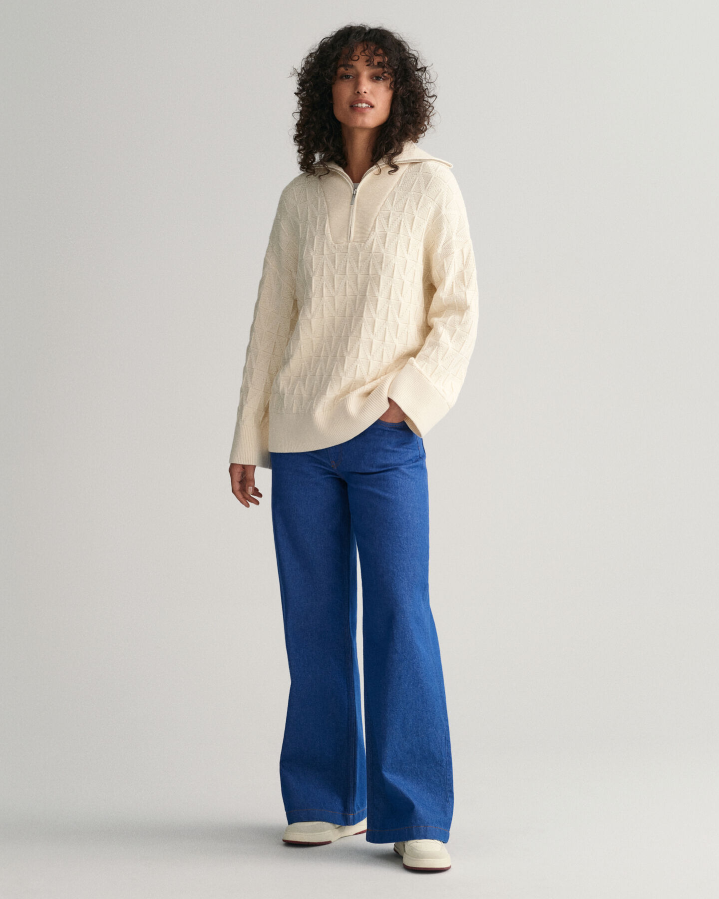 Jersey con media cremallera y diseño de espiga